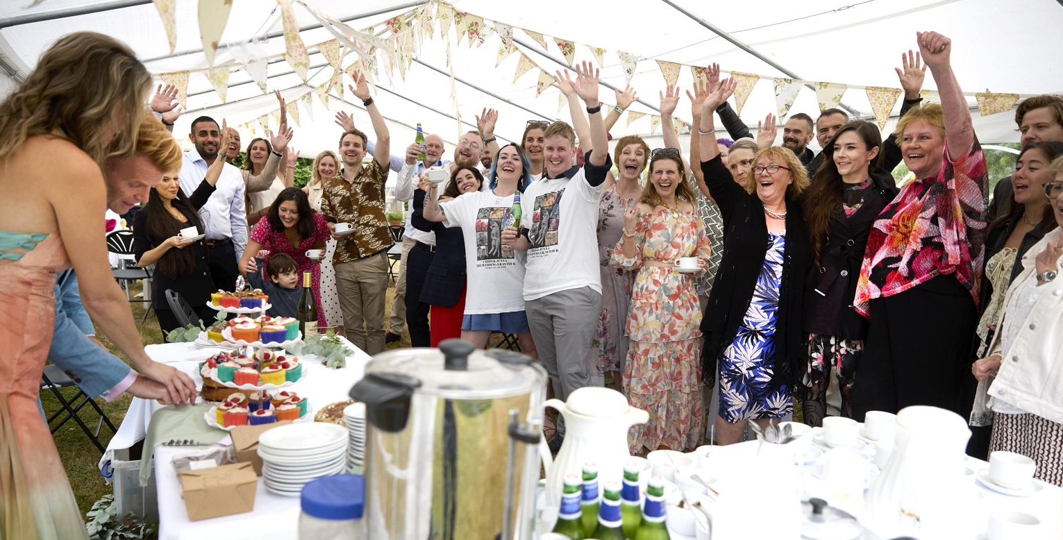 The group cheering the cake